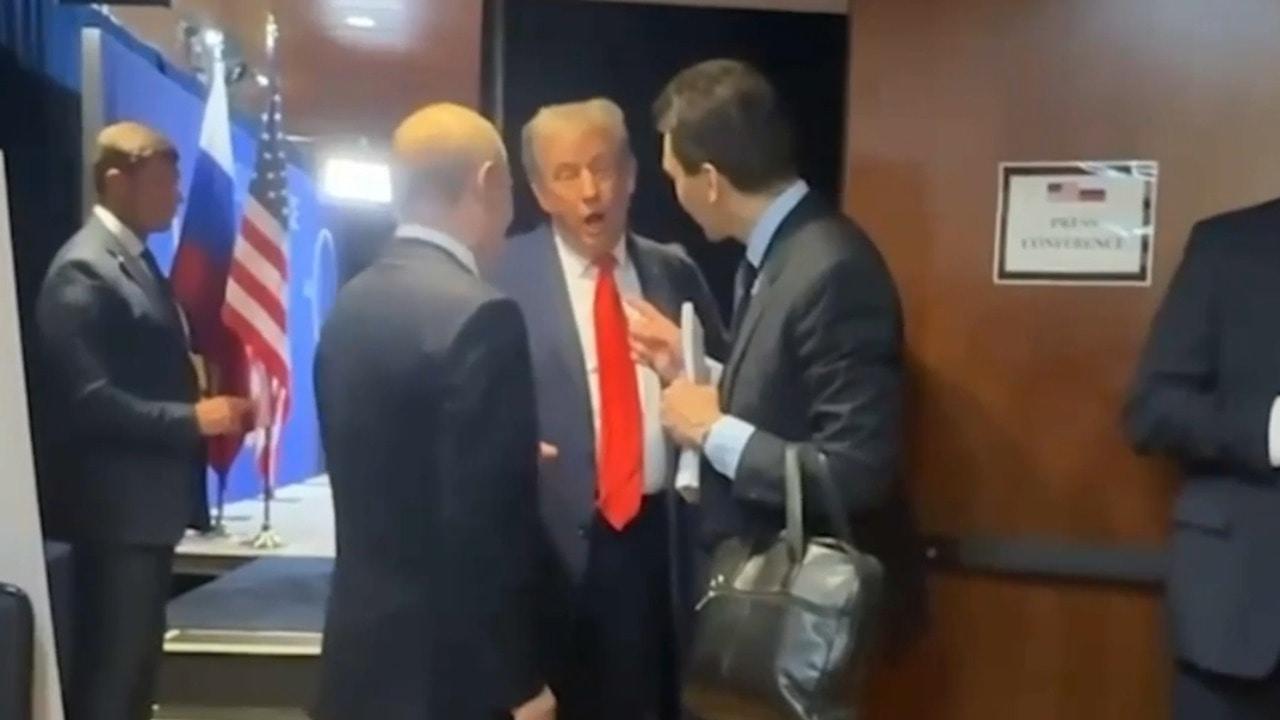 Behind the scenes - Putin, Trump seen chatting following talks in Anchorage
