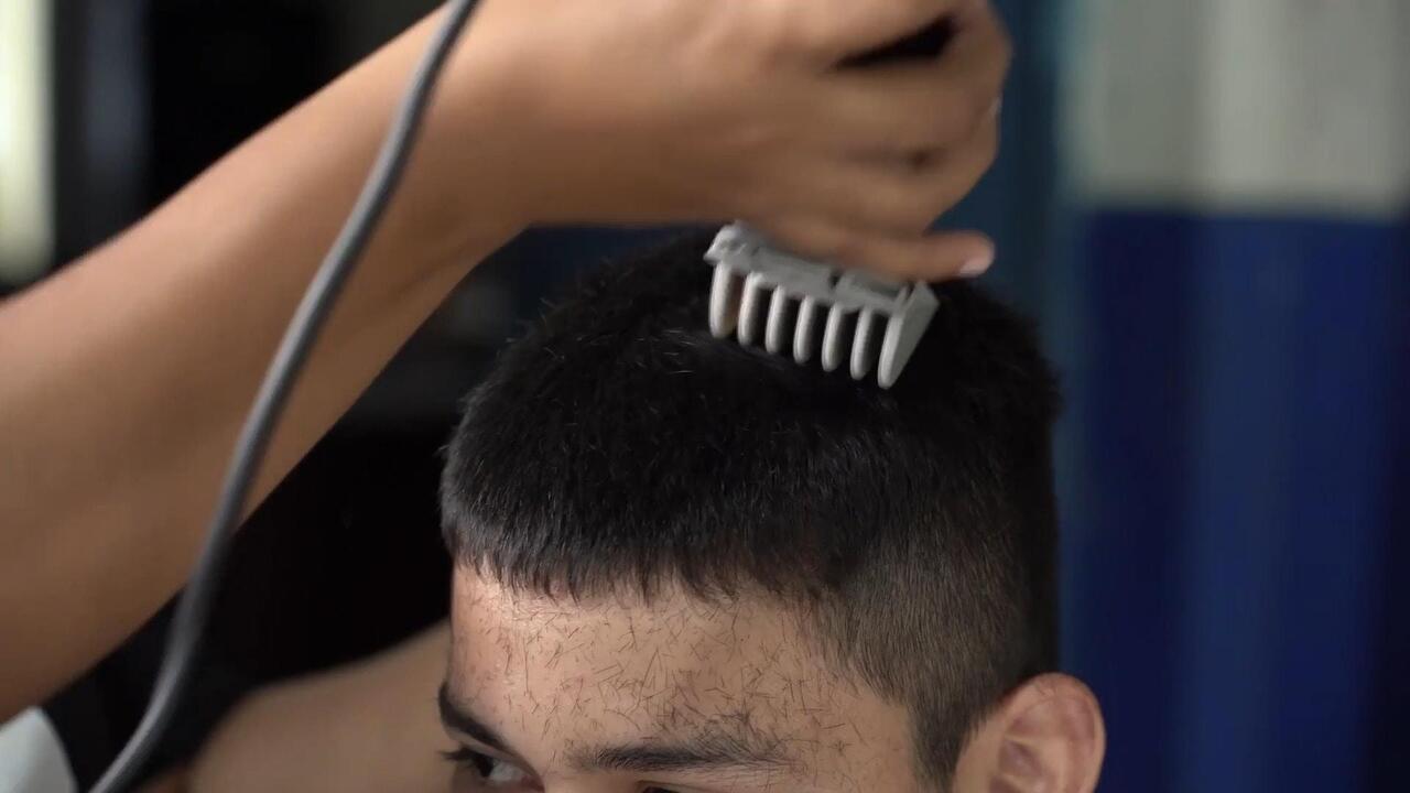 Shape up! Salvadoran students get free buzz cuts as military discipline hits schools

