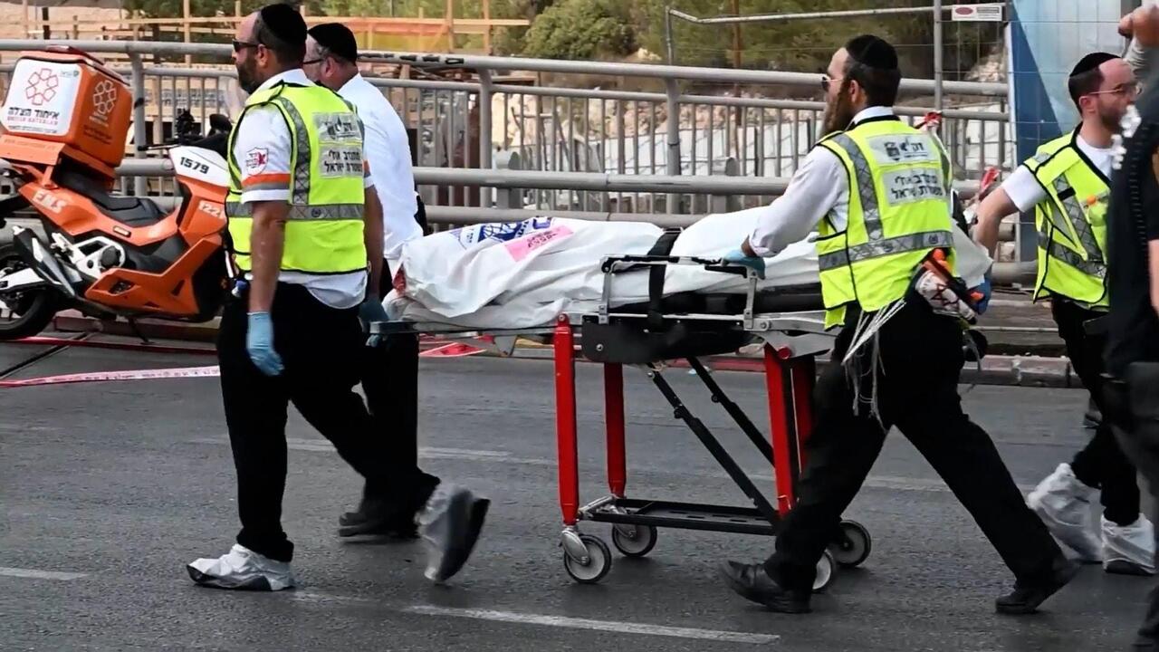 Jerusalem aftermath - Medics remove bodies following deadly shooting
