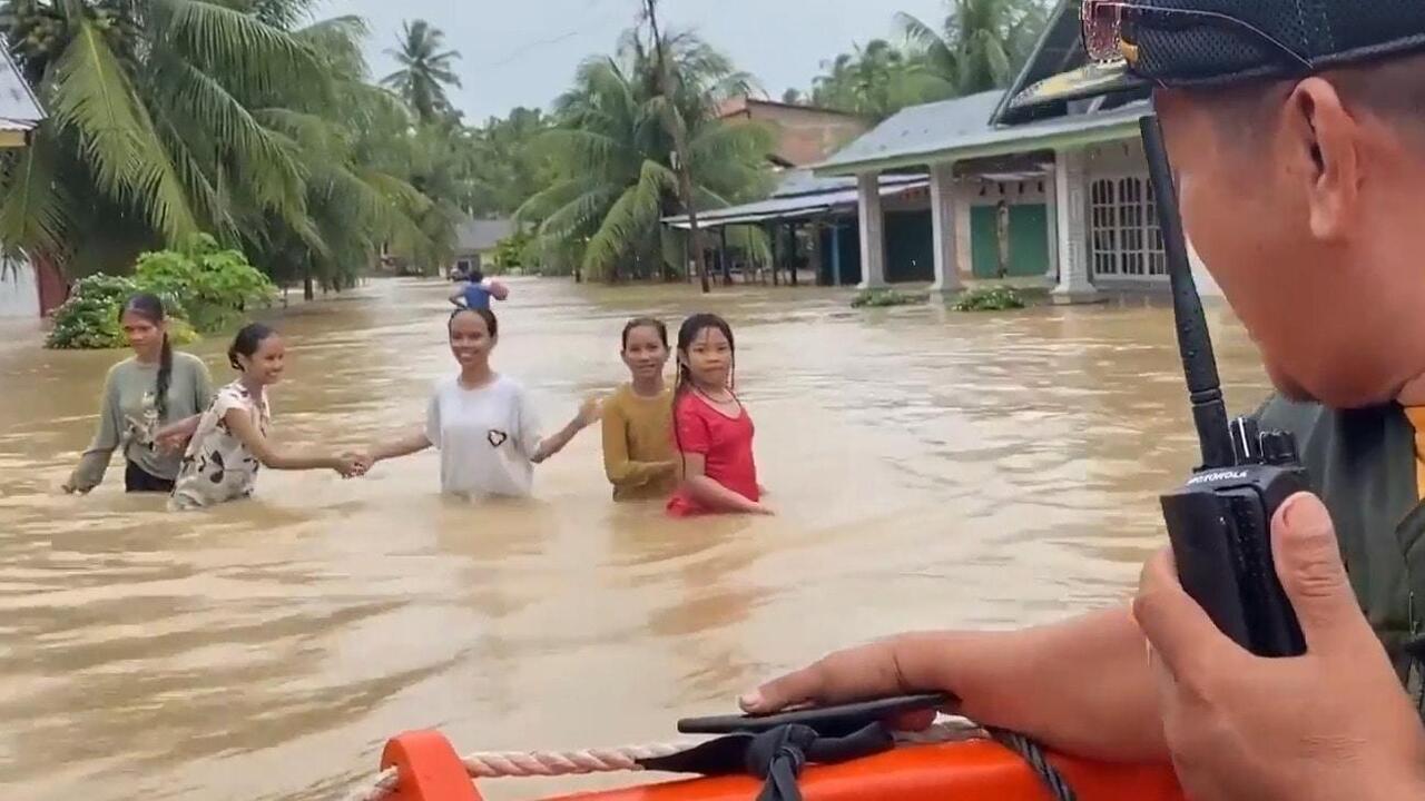 Saving lives - Rescue boats race to evacuate locals hit by flooding in West Sumatra

