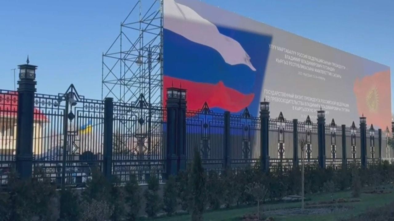Clever cover! Kyrgyzstan uses HUGE billboard welcoming Putin to disguise Kiev's embassy
