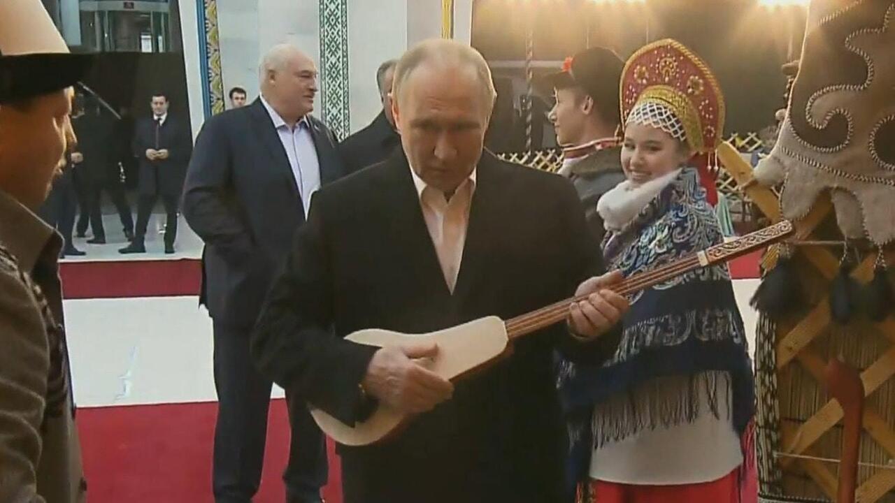 Give us a tune, Mr President! Putin plays Kyrgyzstan's national instrument
