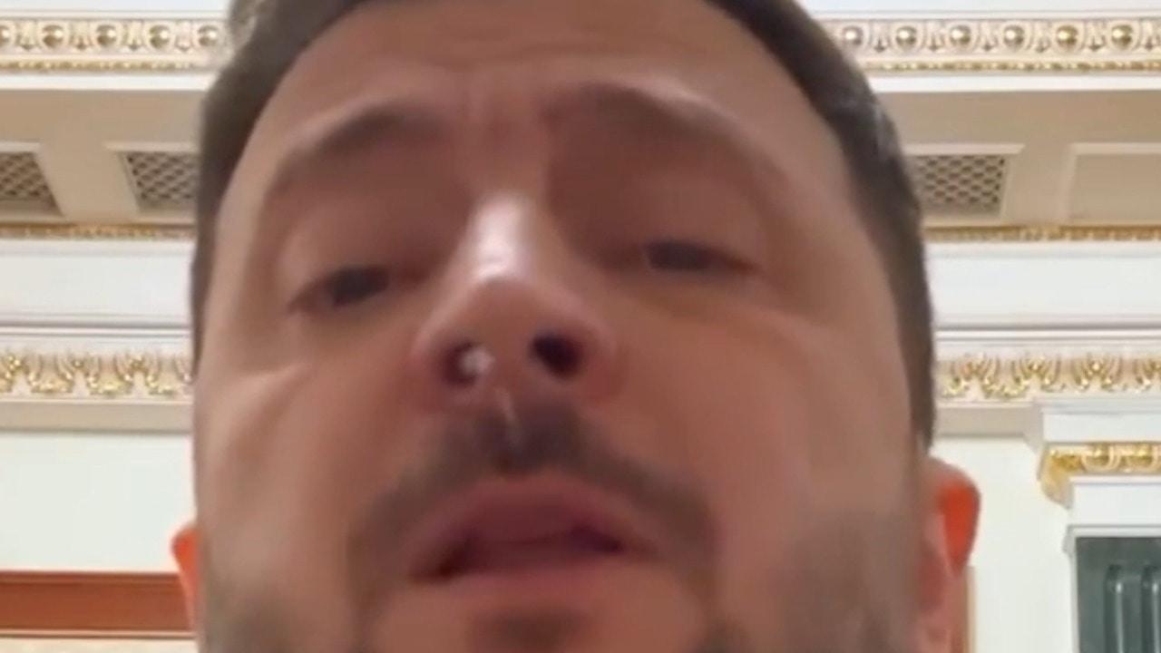 Something get up your nose?! - Blob of white 'gloop' flies from Zelensky's face 
