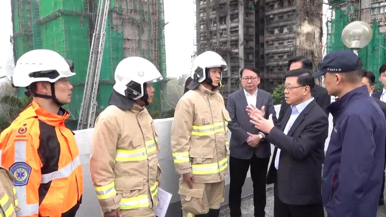 Blaze aftermath - Hong Kong's Lee at charred high-rises as death toll soars