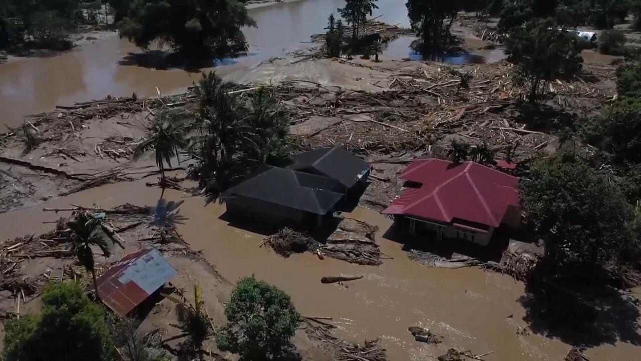 Indonesia flooding - Over 400 killed as death toll across Asia soars to nearly 1,000

