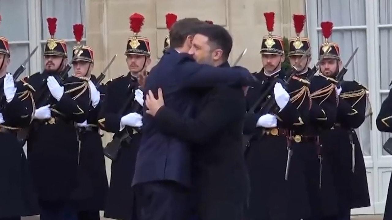 Someone needs a hug?! Scandal-hit Zelensky cuddled by Macron at second talks in two weeks
