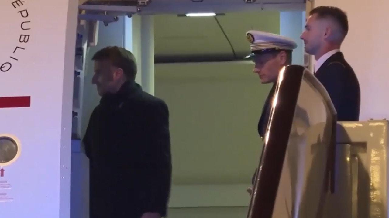 What's going on back there?! Macron appears, disappears, reappears with Brigitte 
