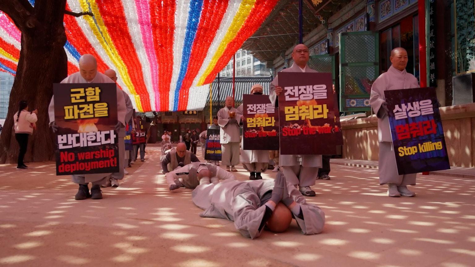 Prostration for peace - Seoul monks hold street ritual to protest Iran ...