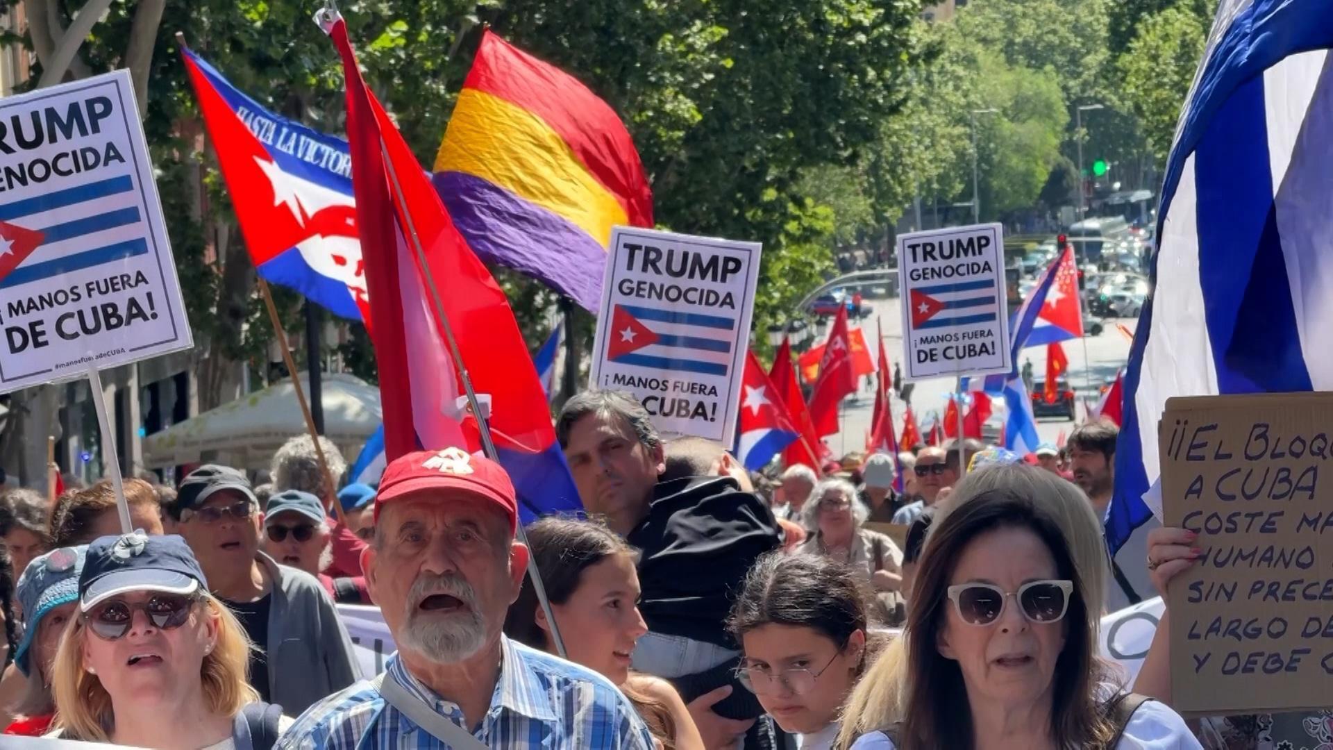 'Fanatic destroying the world' - Madrid protesters rally against ...