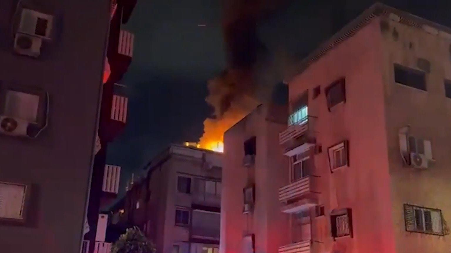 Fire erupts in Israel's Holon as shrapnel hits building after Iranian ...