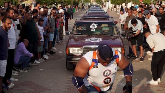 From Cairo to car-go - Egyptian wrestler 'Kabonga' muscles 20 vehicles in Guinness World record attempt