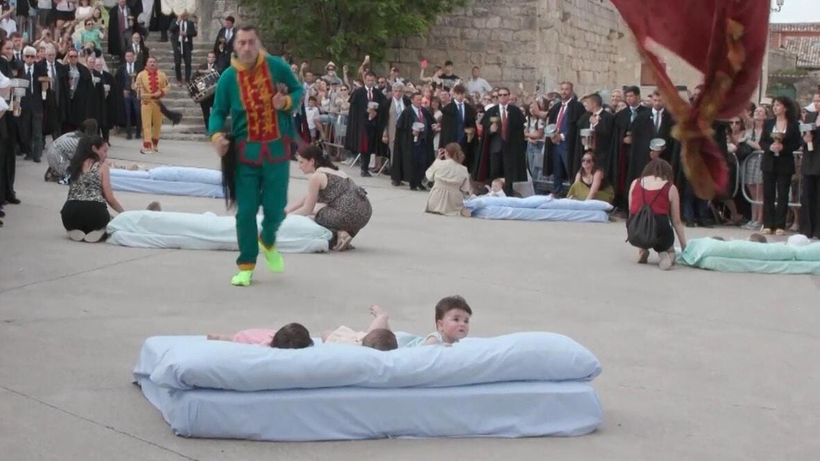For God's sake, think of the children! Masked 'devils' leap over ...