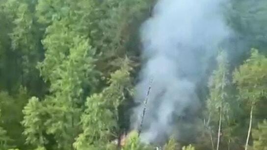 Russia plane crash - Smoke seen billowing from site of An-24 disaster in Far East