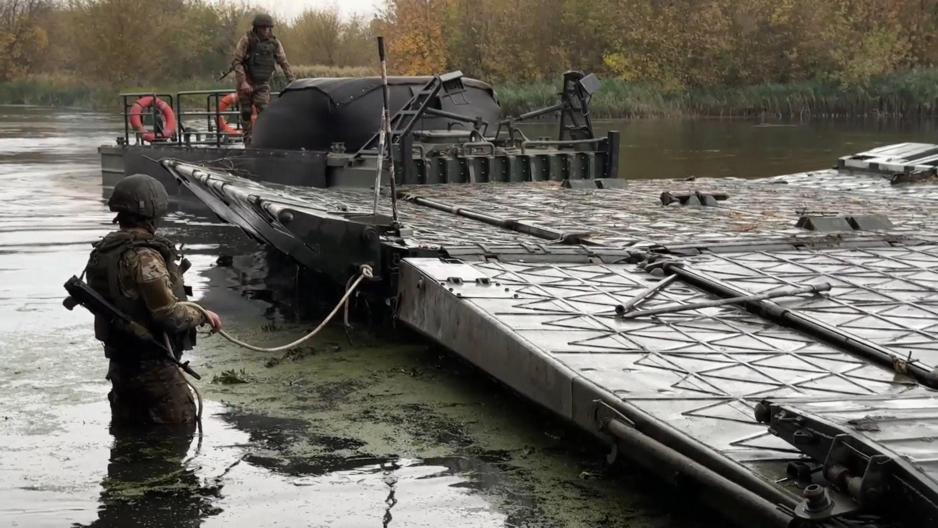 Russian engineering units deploy pontoon bridge across river in Kursk ...